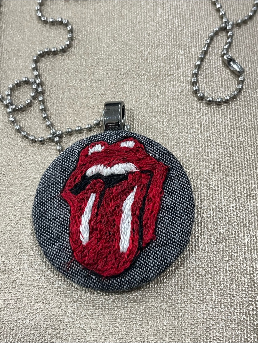 Rolling Stones tongue out hand embroidered thread paint pendant necklace